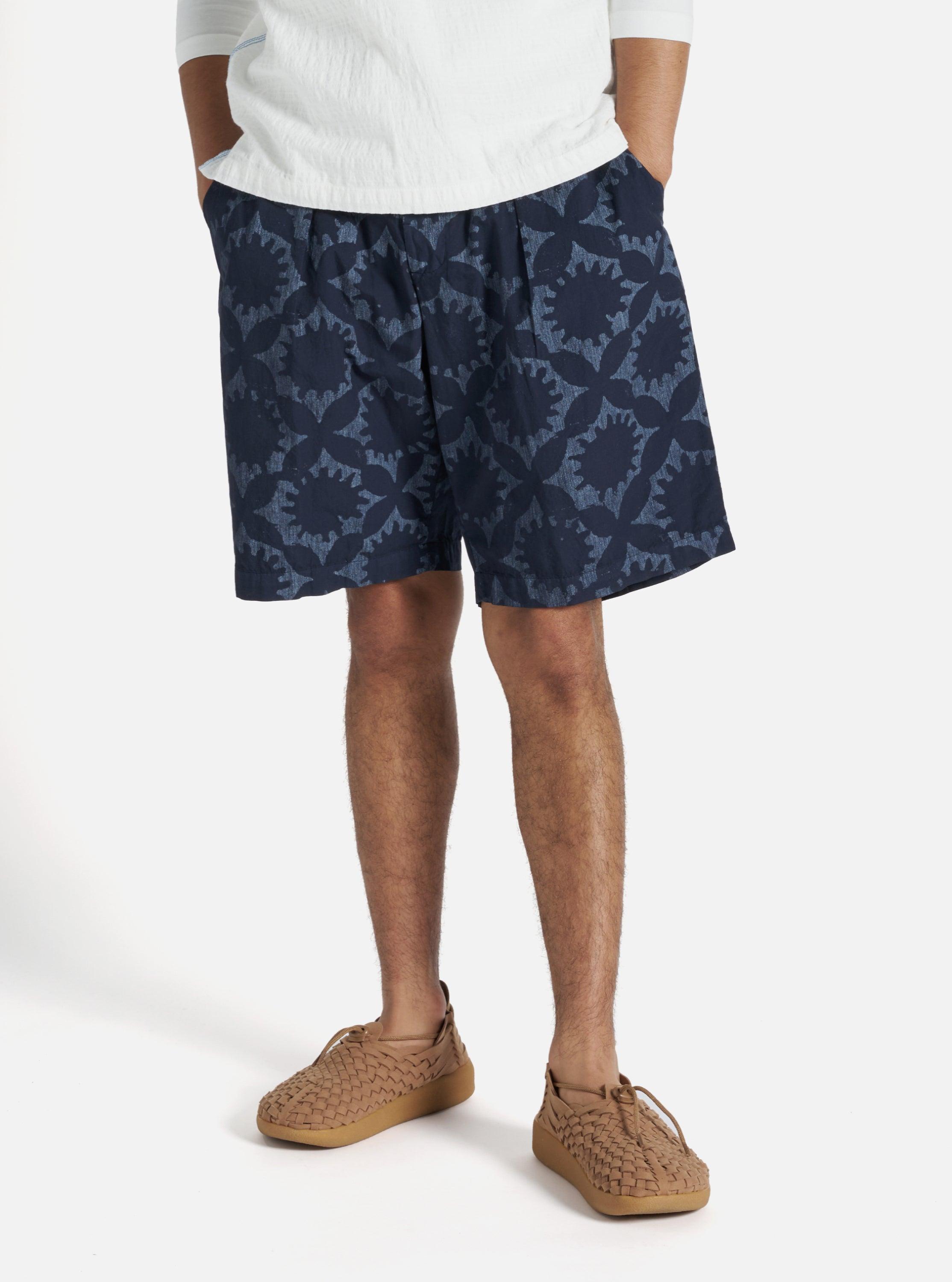 Universal Works Pleated Track Short in Navy Over Dyed Sun Print Product Image