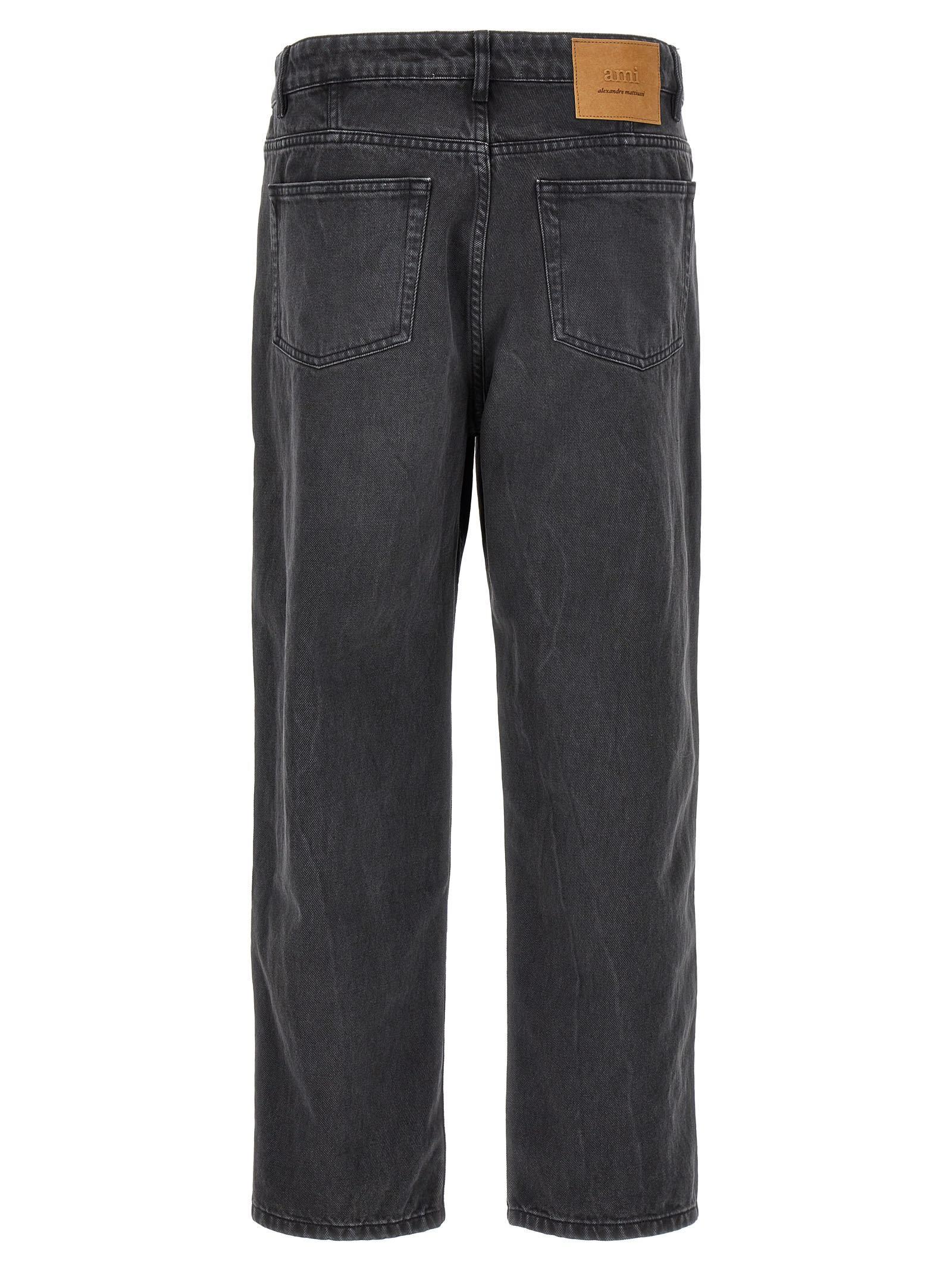 AMI ALEXANDRE MATTIUSSI Ami Paris Logo Patch Tapered Fit Jeans In Schwarz Product Image