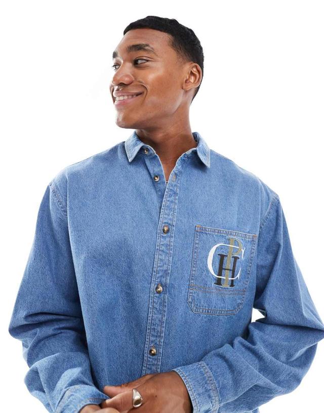 ASOS DESIGN boxy oversized denim shirt with chest embroidery in mid blue  Product Image