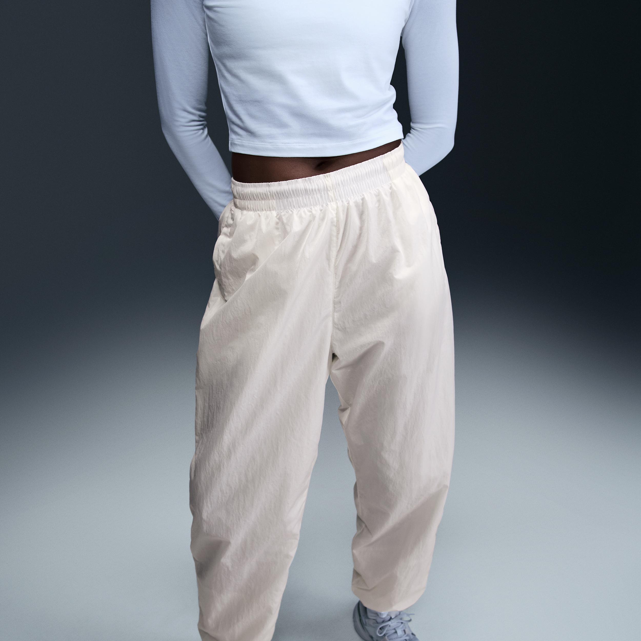 Women's Nike Sportswear Essential Mid-Rise Oversized Woven Jogger Pants Product Image