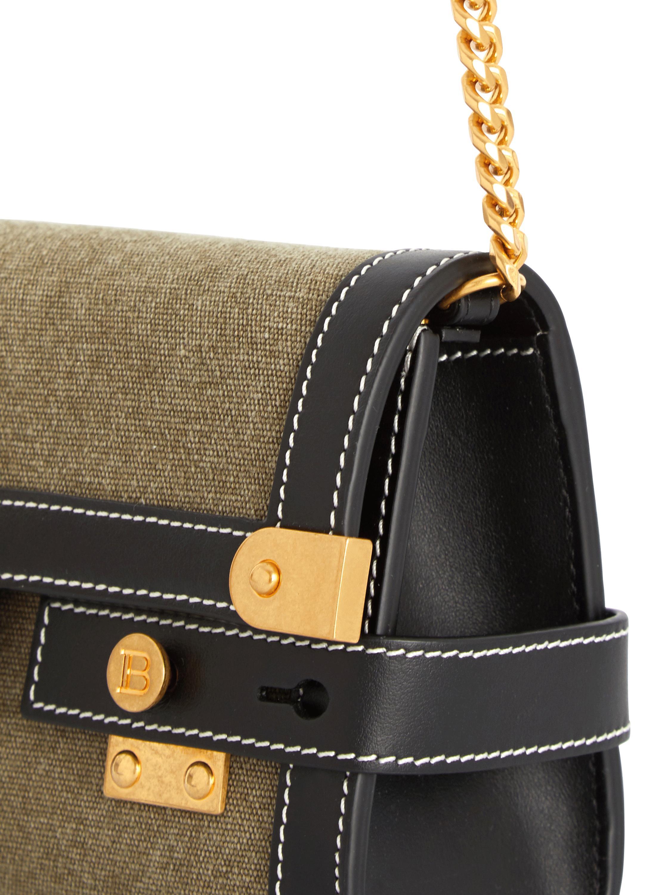 Canvas B-Buzz 23 clutch bag with leather panels Product Image