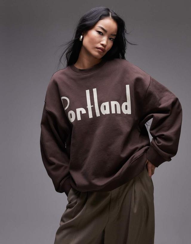 Topshop graphic Portland oversized sweatshirt in brown Product Image