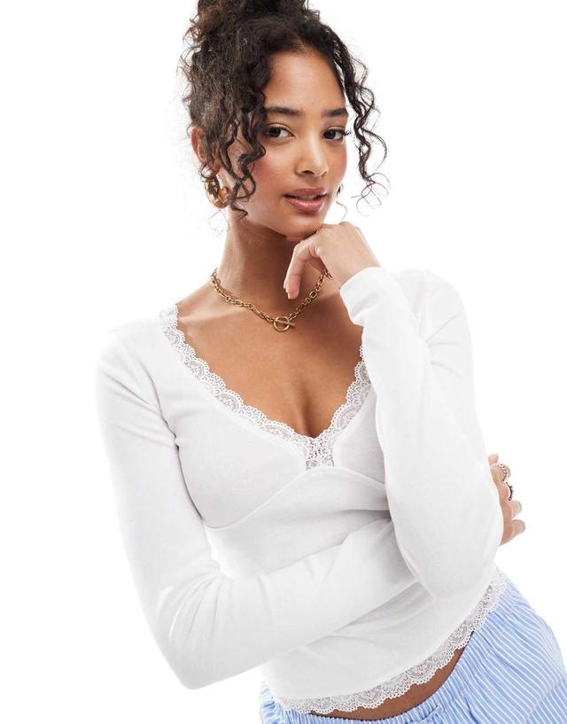 ASOS DESIGN v neck long sleeve top with lace detail in white Product Image