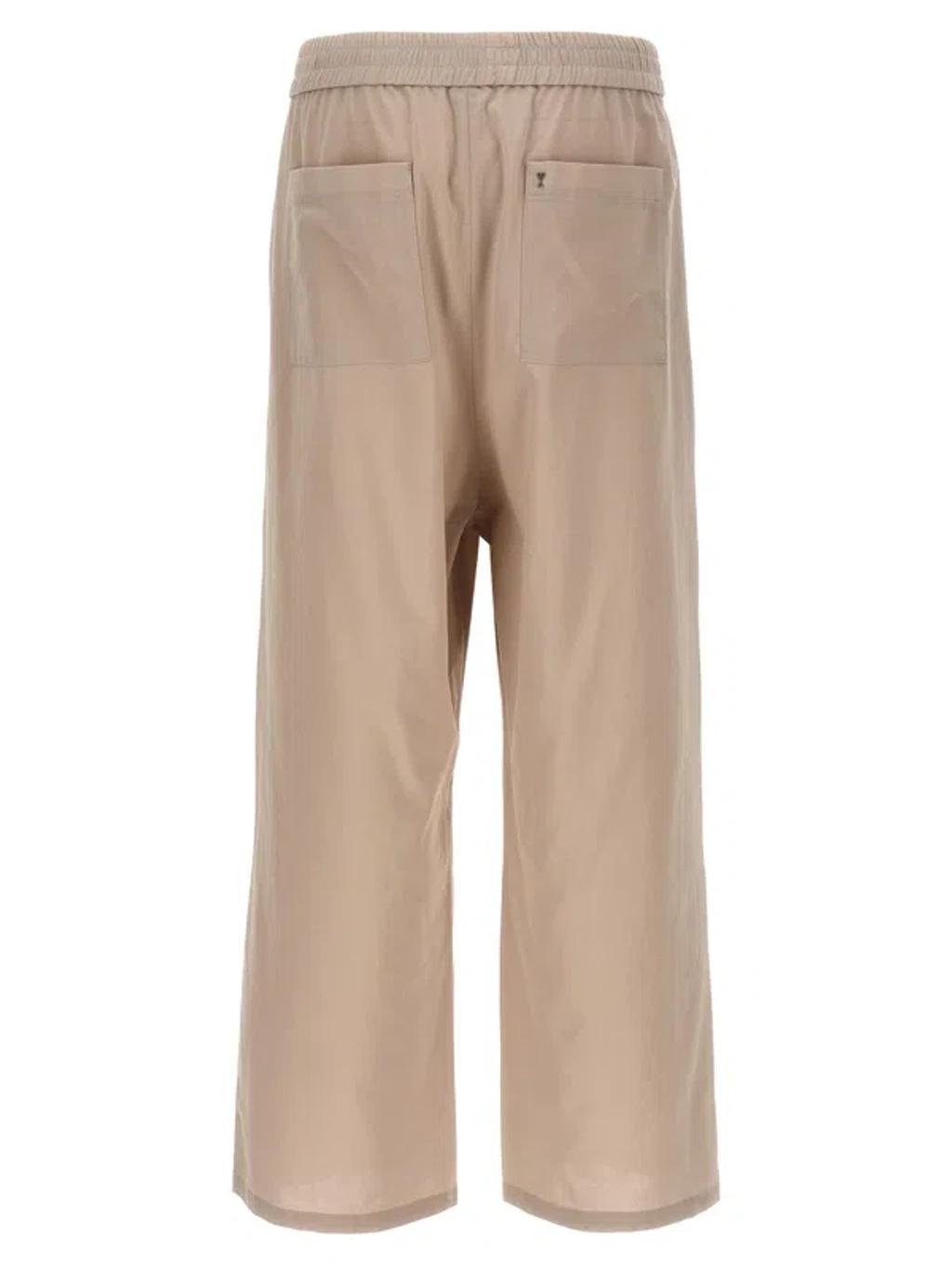 AMI ALEXANDRE MATTIUSSI Logo Plaque Trousers Pants Beige Product Image