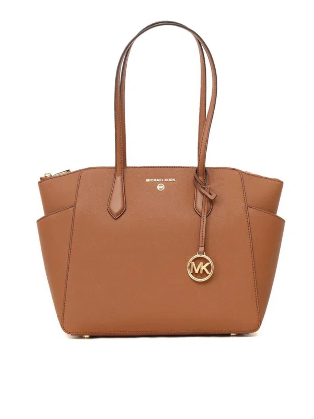 MICHAEL KORS Hand Held Bag. In Brown Product Image