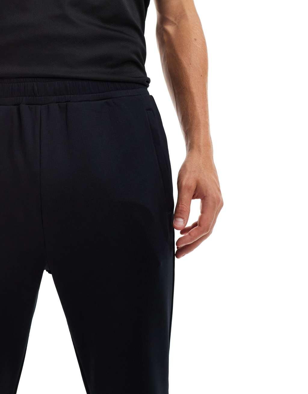 ASOS 4505 tapered thermal fleece lined running sweatpants with zip pockets in black Product Image