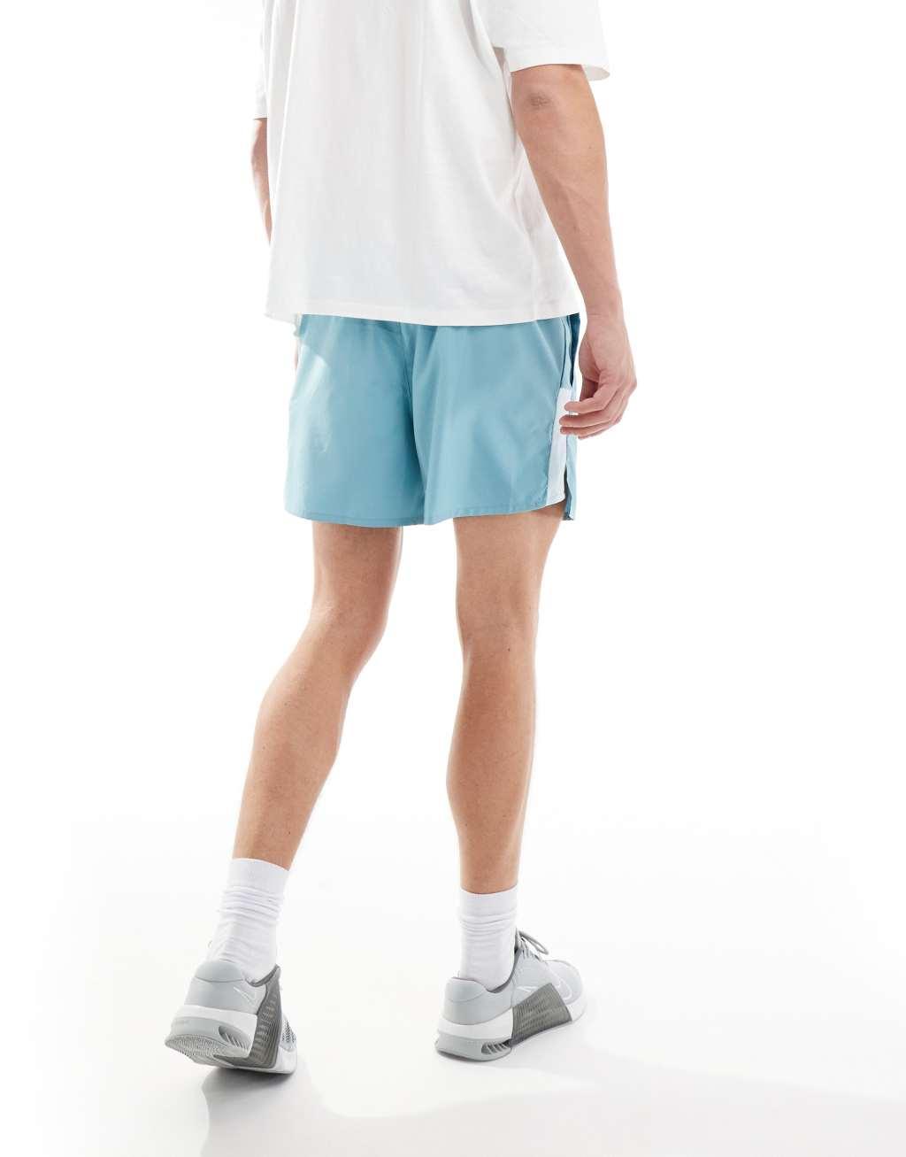 Nike Running Challenger Dri-FIT 5 inch shorts in light blue Product Image