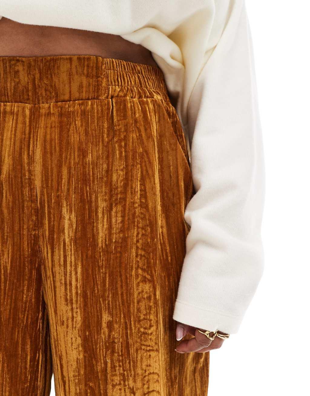 ASOS DESIGN Curve crinkle velvet pull on pants in gold Product Image