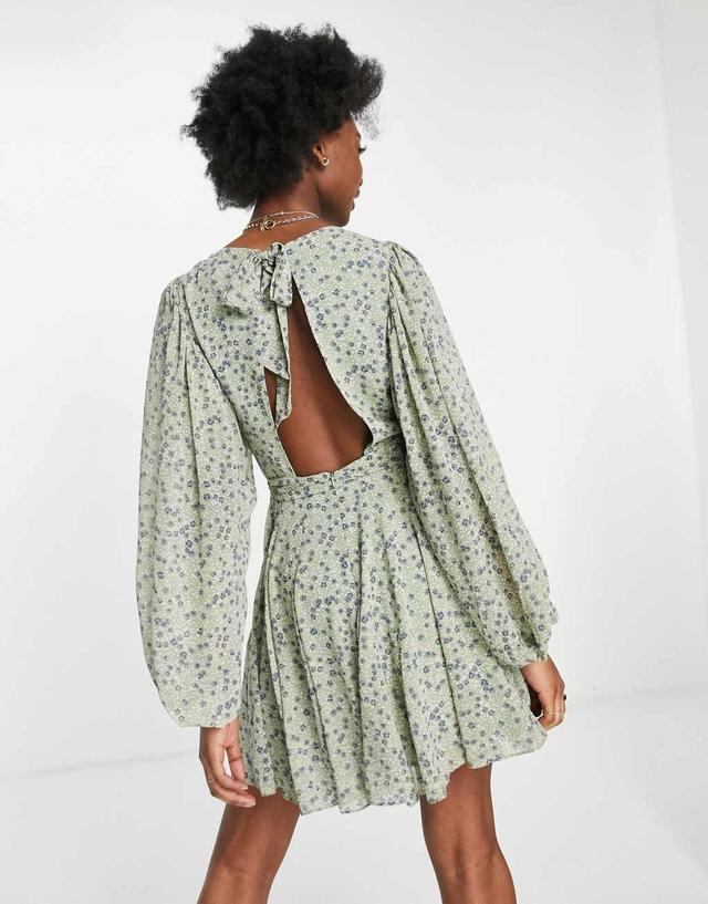 Ever New open back volume sleeve mini dress with tie waist in green ditsy floral Product Image