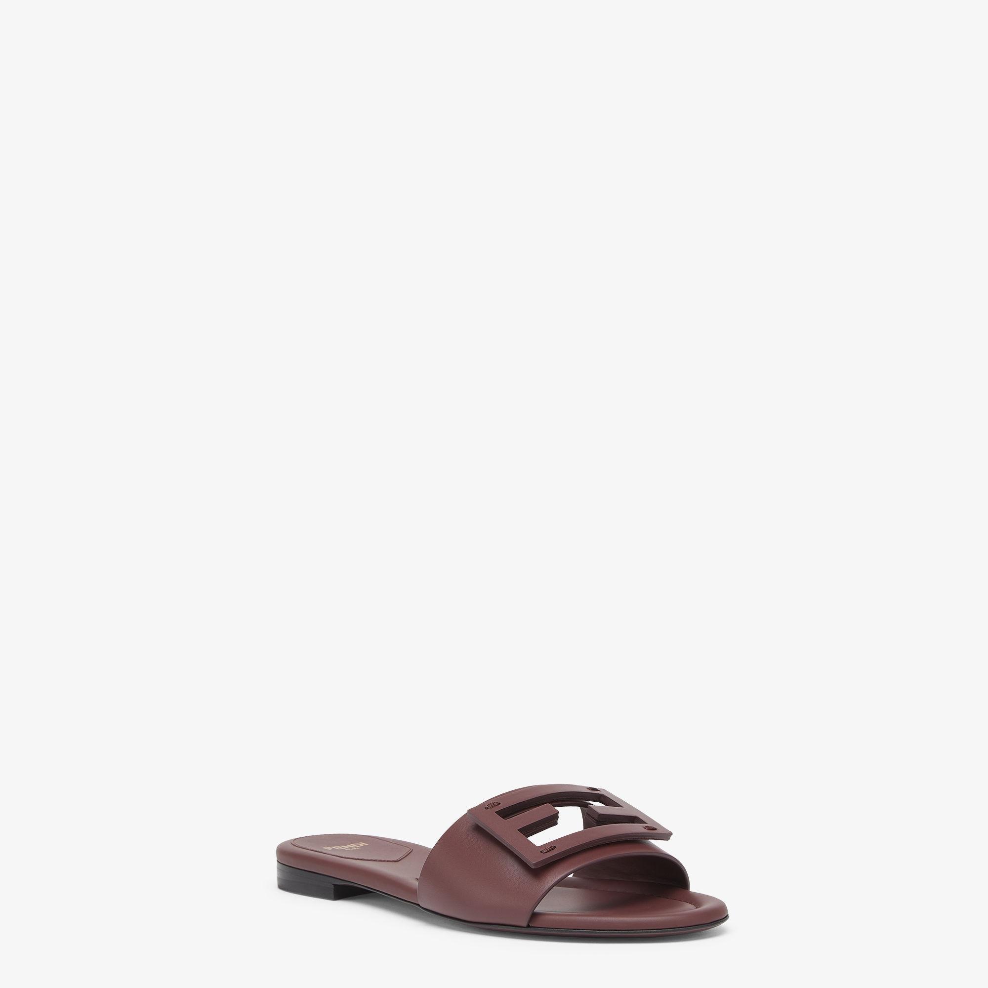 BaguetteBrown leather slides Product Image