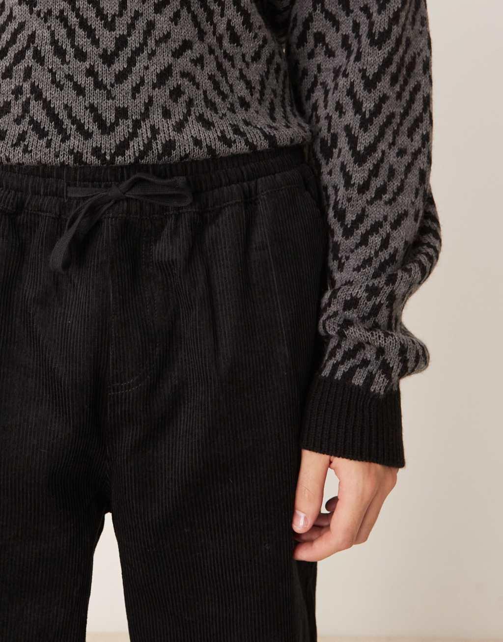 ASOS DESIGN tapered pull on corduroy sweatpants in black  Product Image