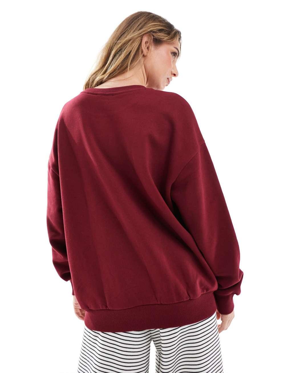 ASOS DESIGN oversized sweatshirt with Amsterdam puff print graphic in burgundy Product Image