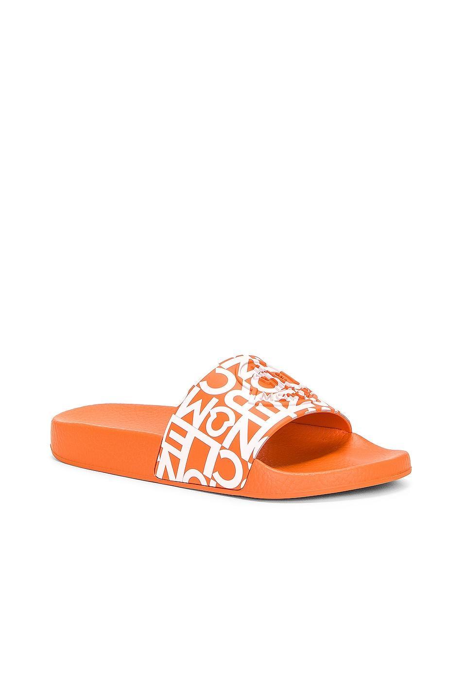 Moncler Jeanne Slides in Orange - Orange. Size 40 (also in 36, 37, 41). Product Image