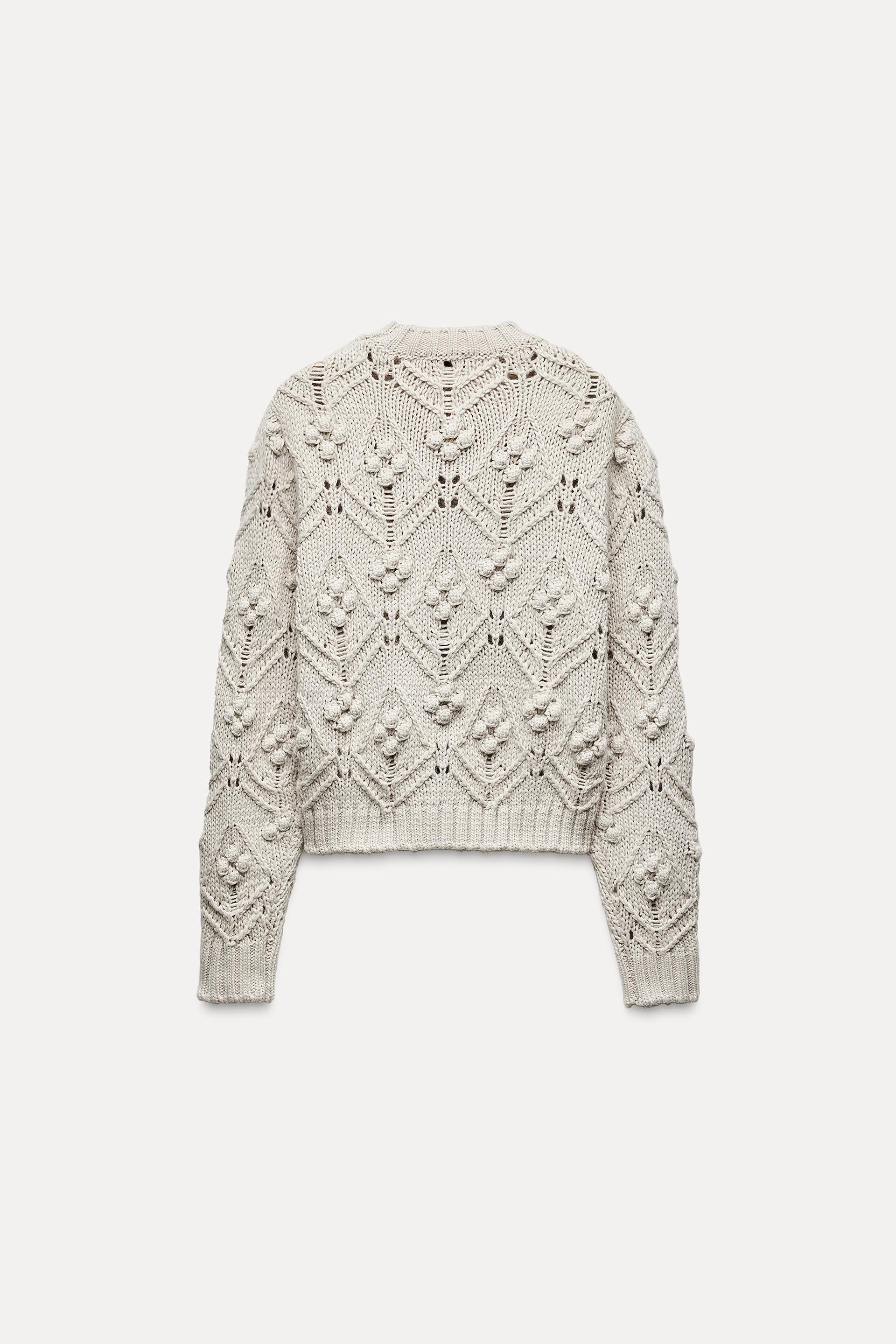 CABLE KNIT SWEATER WITH POMPOMS Product Image