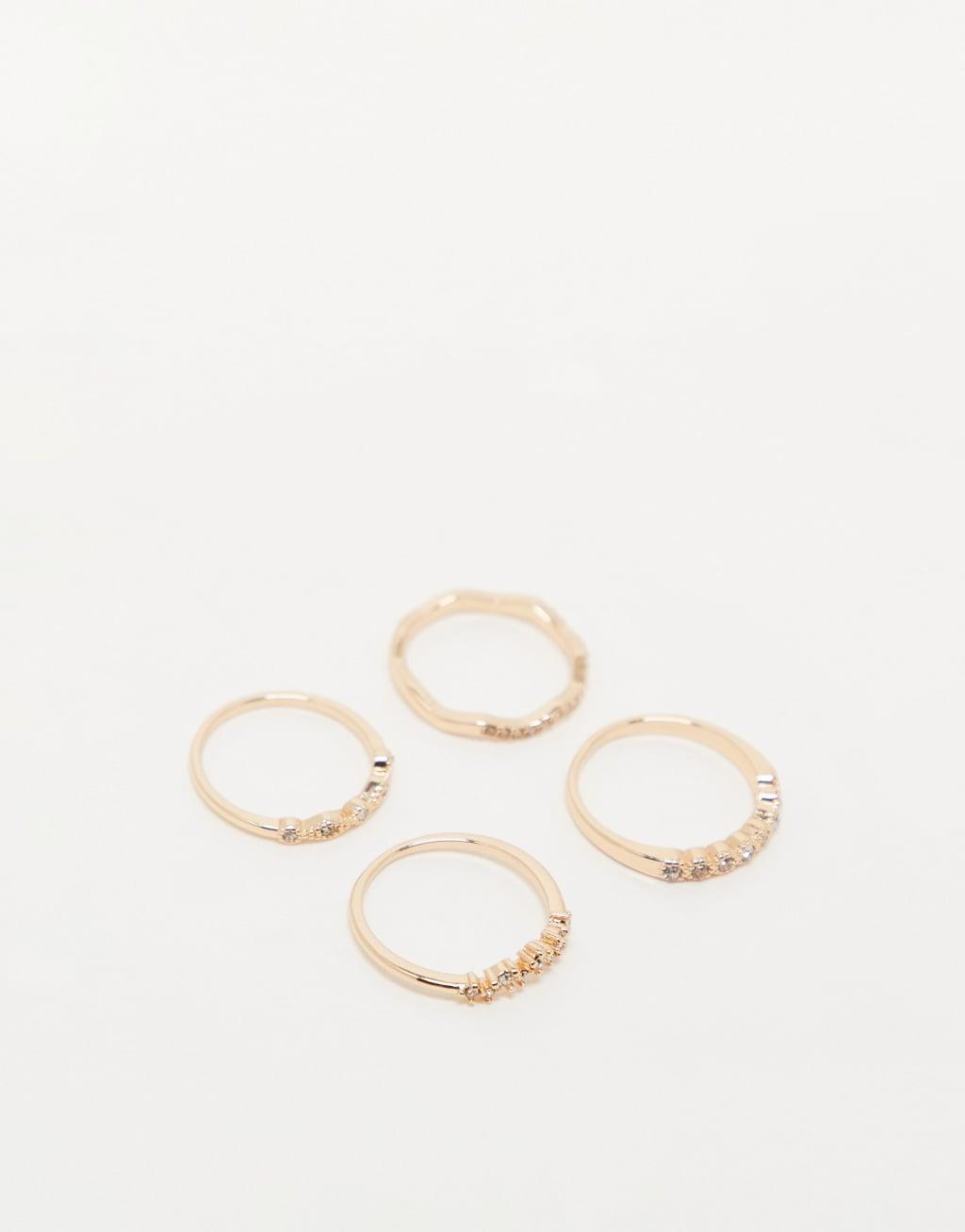 ASOS DESIGN pack of 4 rings with delicate crystal detail in gold tone Product Image