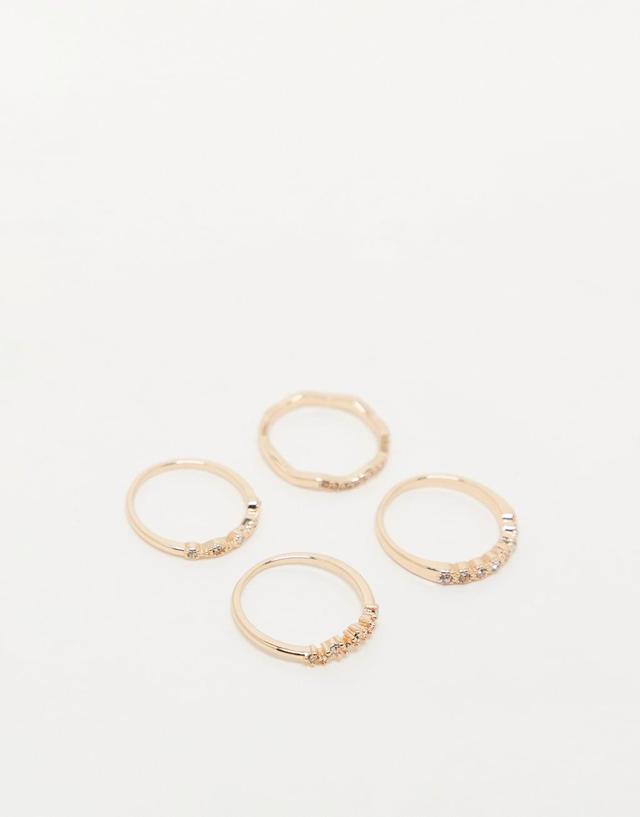 ASOS DESIGN pack of 4 rings with delicate crystal detail in gold tone Product Image