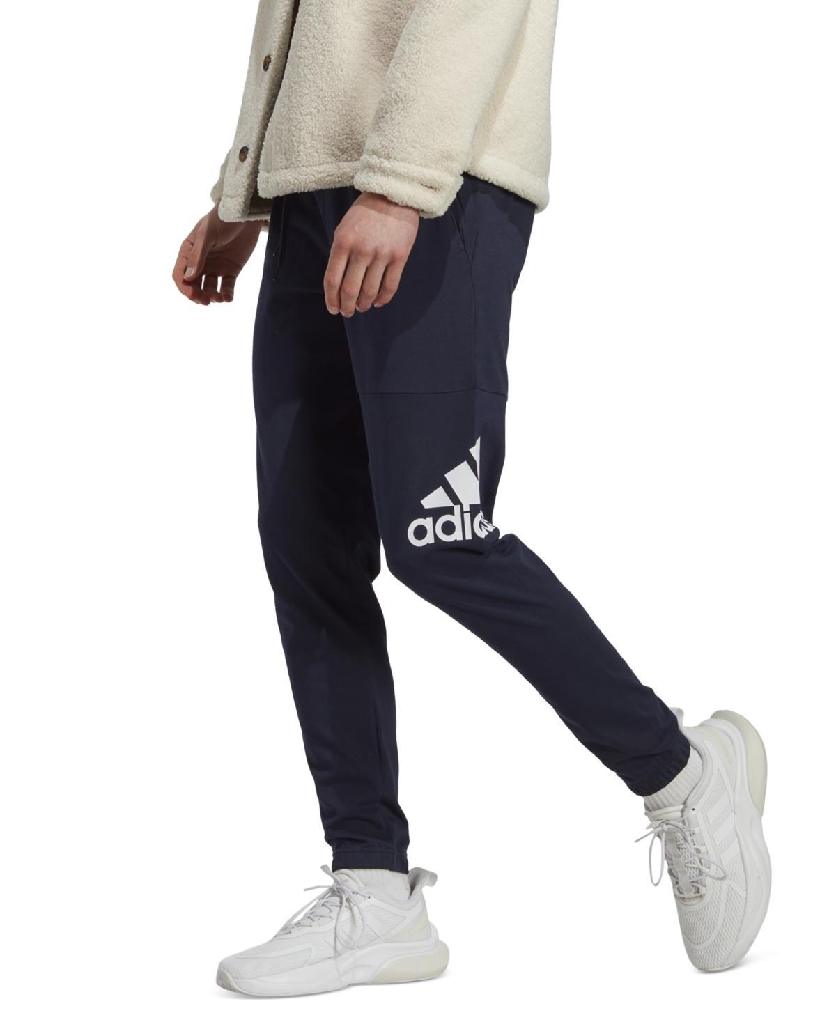 Mens adidas Essentials Badge of Sport Jersey Tapered Pants Dark Blue Product Image