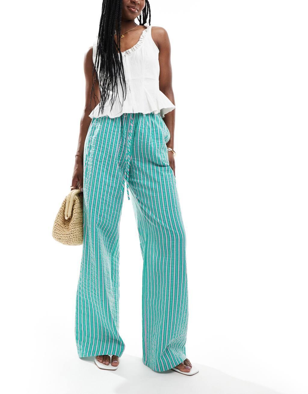 ASOS DESIGN seersucker tie waist wide leg pants in green & pink stripe Product Image