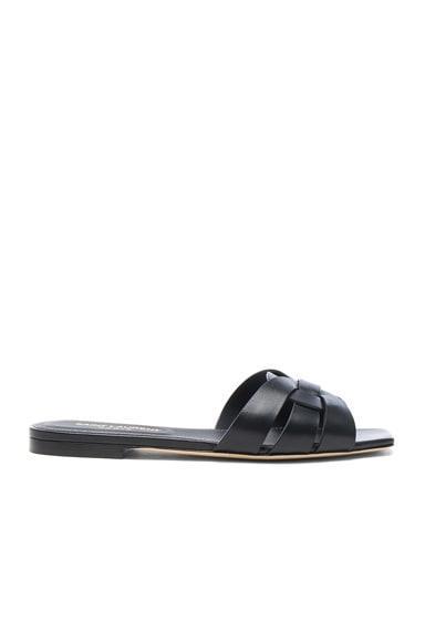 Saint Laurent Tribute Flat Sandals in Black - Black. Size 35 (also in 35.5, 36, 37, 38, 40, 41). Product Image