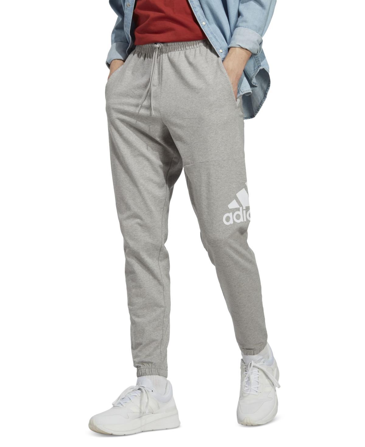 Mens adidas Essentials Badge of Sport Jersey Tapered Pants Dark Blue Product Image