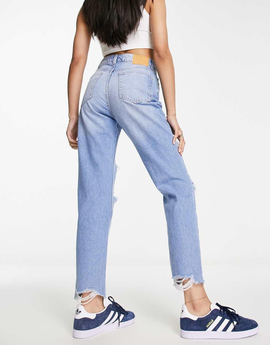 Bershka comfort fit mom jean with rips in light blue Product Image