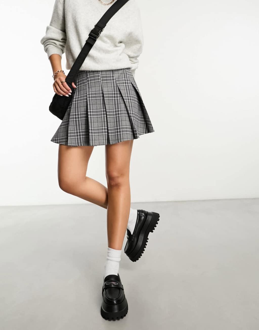 ASOS DESIGN pleated mini kilt skirt with buckle in gray plaid Product Image