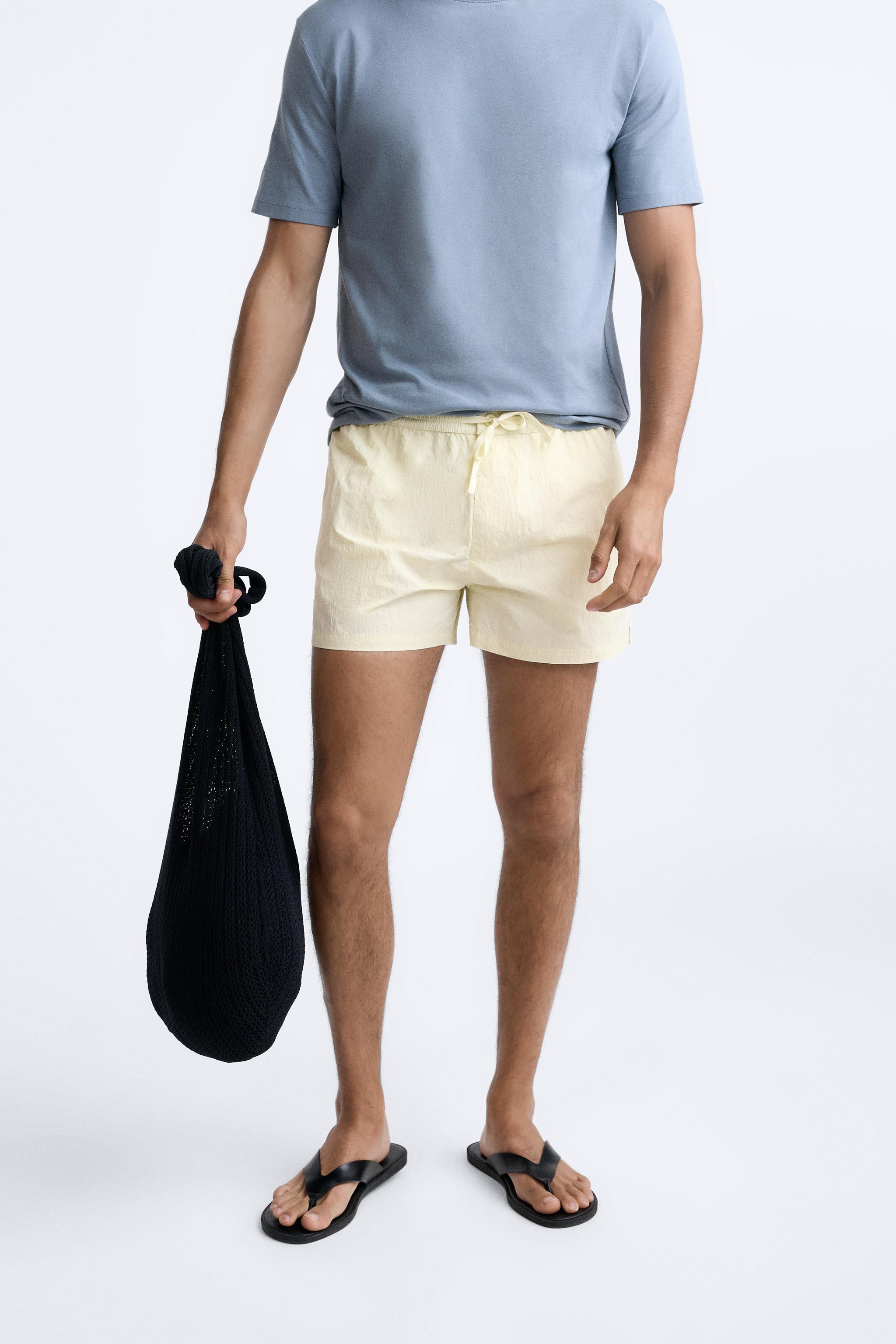 BUTTON SHORT SWIMMING TRUNKS Product Image