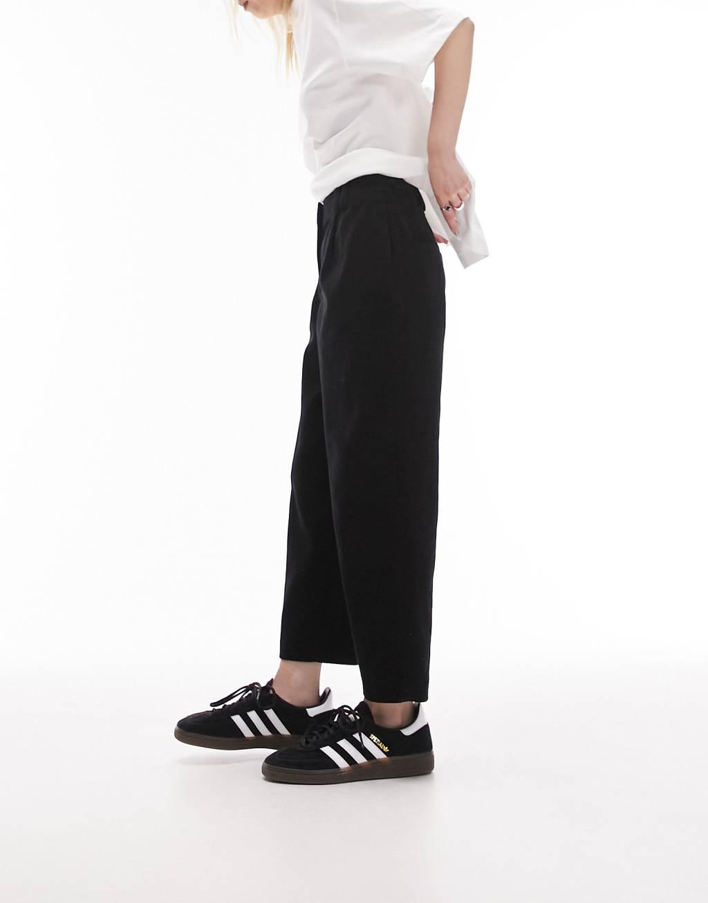 Topshop Petite cord peg pants in black Product Image