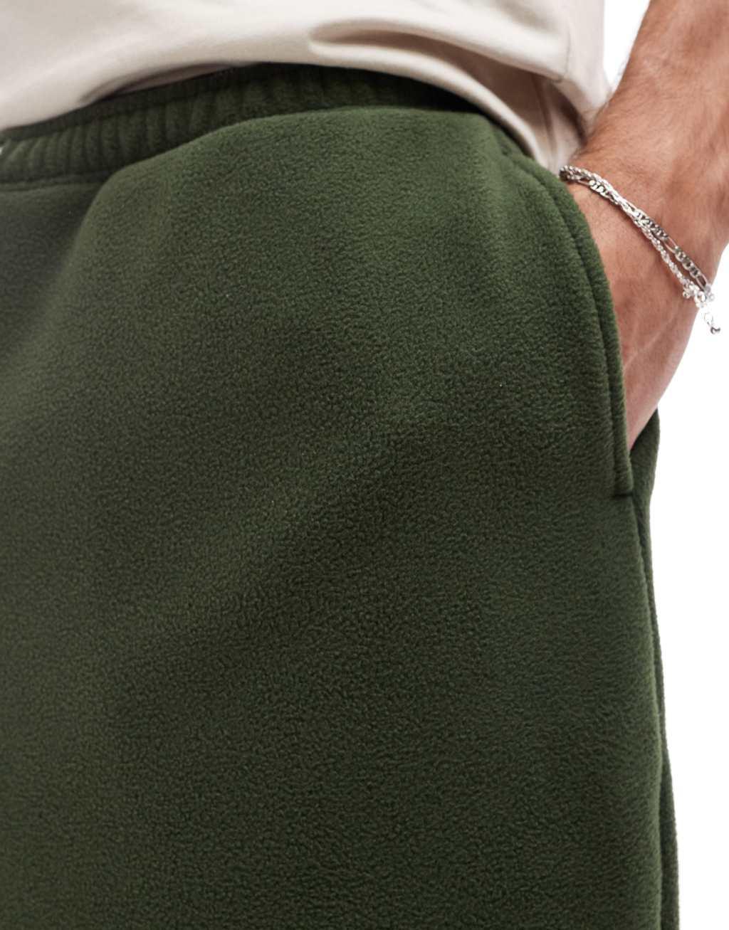 ASOS DESIGN oversized fleece sweatpants in green Product Image