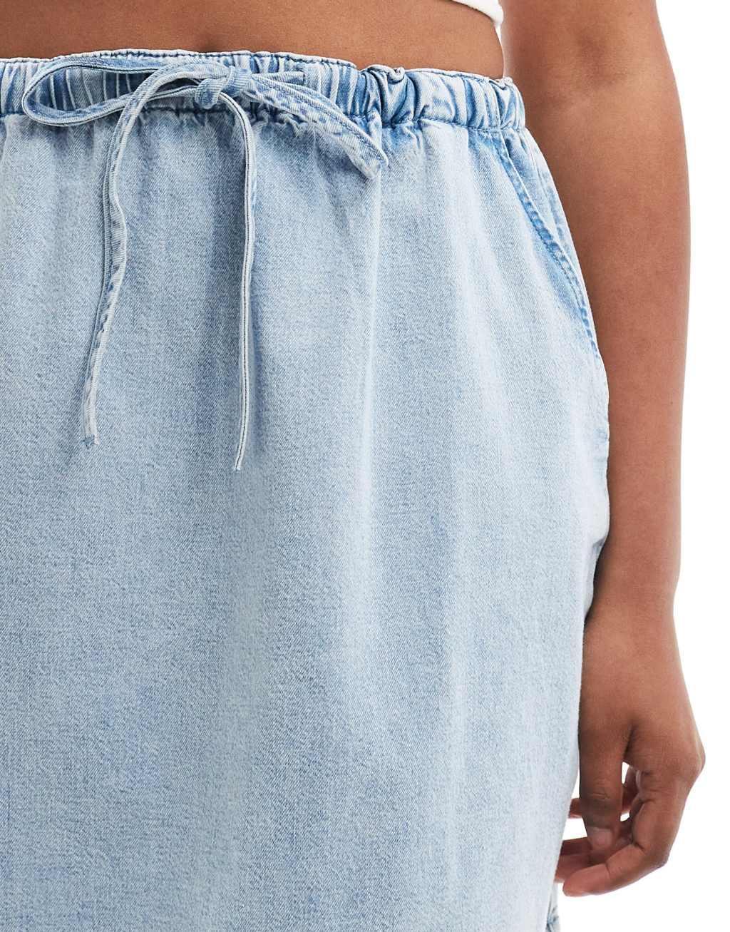 ASOS DESIGN soft denim pull on mini skirt in light wash Product Image