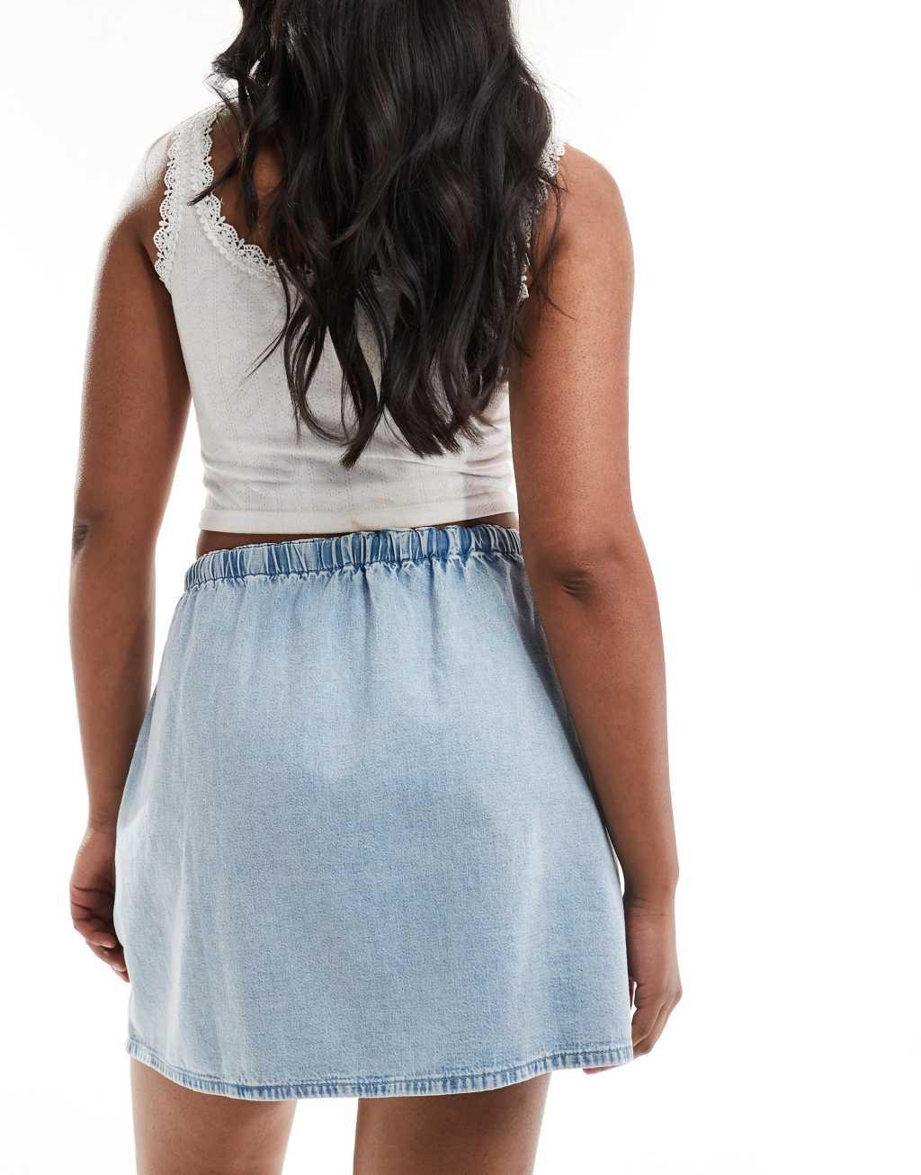 ASOS DESIGN soft denim pull on mini skirt in light wash Product Image