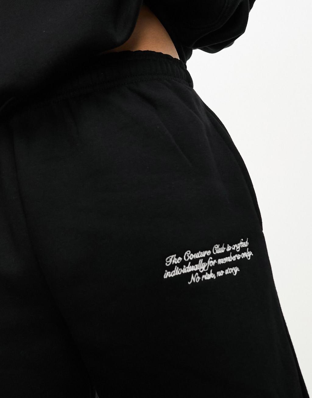 The Couture Club applique sweatpants in black Product Image