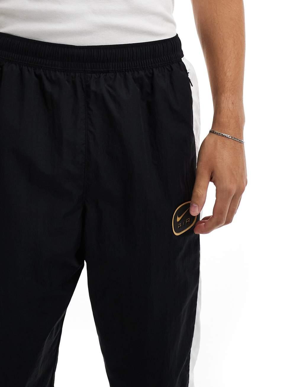 Nike Swoosh Air woven sweatpants in black and white Product Image