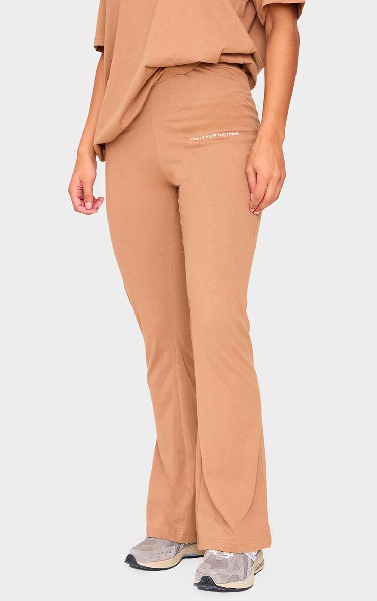 PRETTYLITTLETHING Mocha Printed Flared Pants Product Image