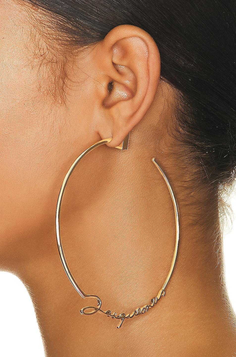 JACQUEMUS Les Creoles Jacquemus Earrings in Metallic Product Image