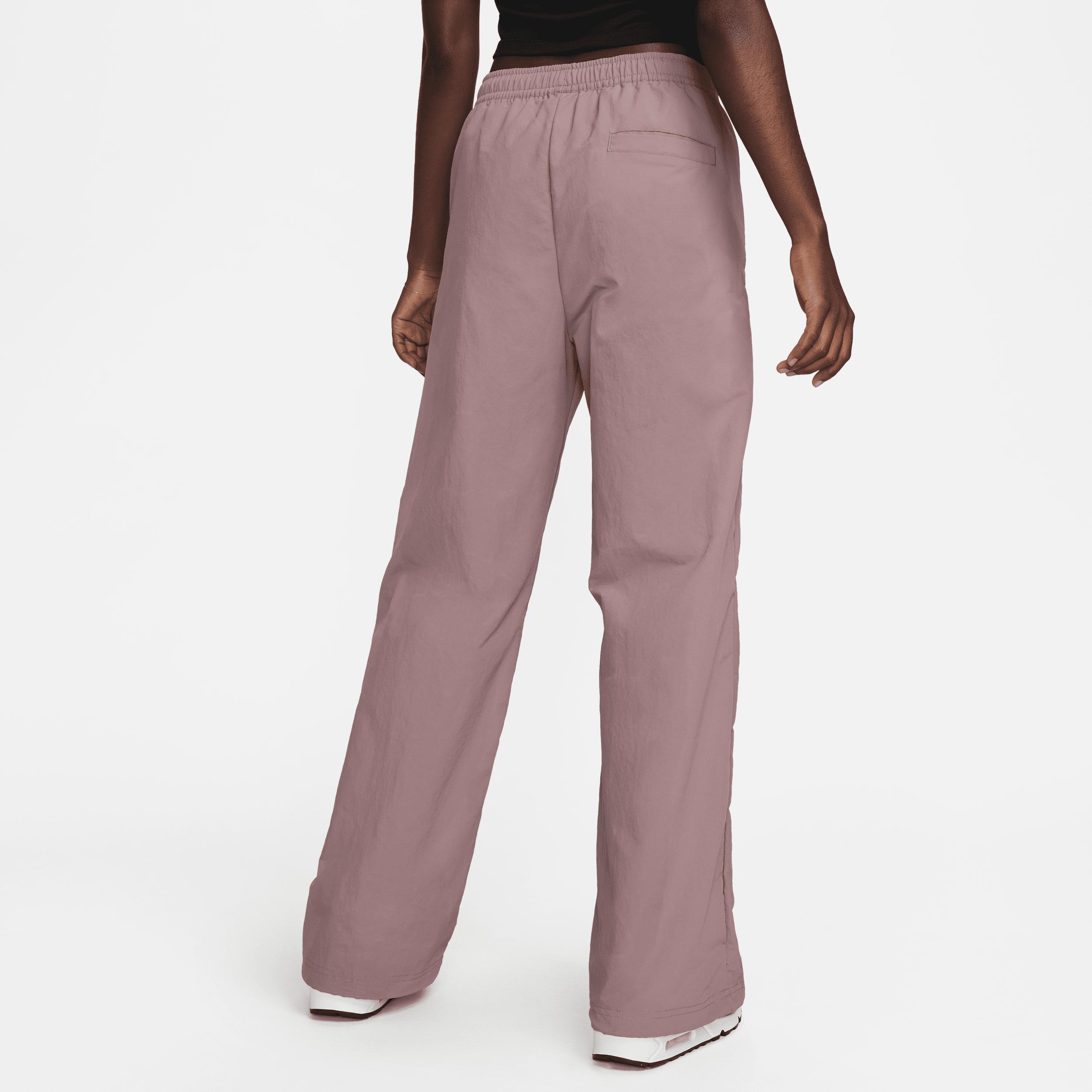 Nike Trend woven baggy parachute pants in smokey mauve Product Image