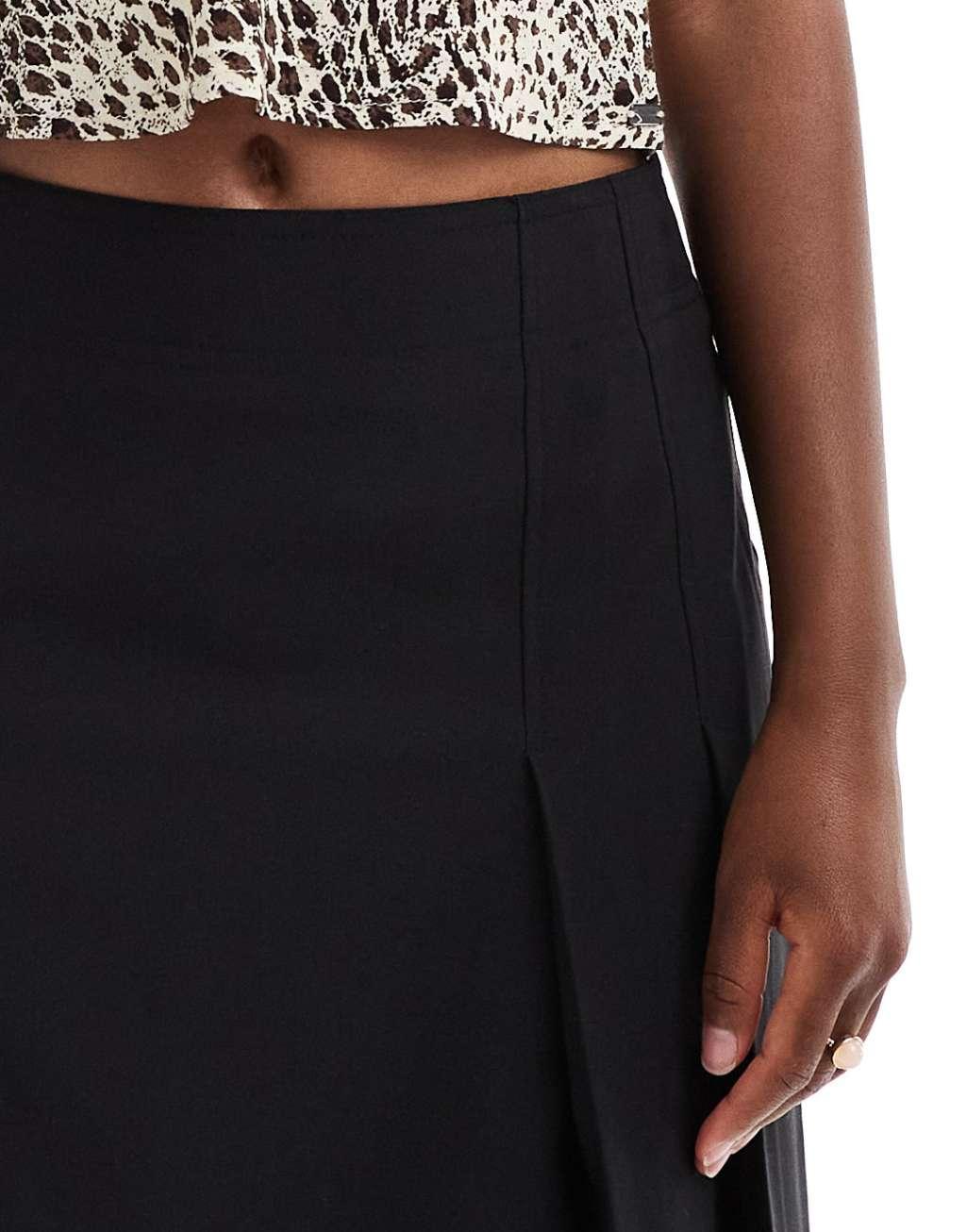 ASOS DESIGN tailored knee length pleated midi skirt in black Product Image