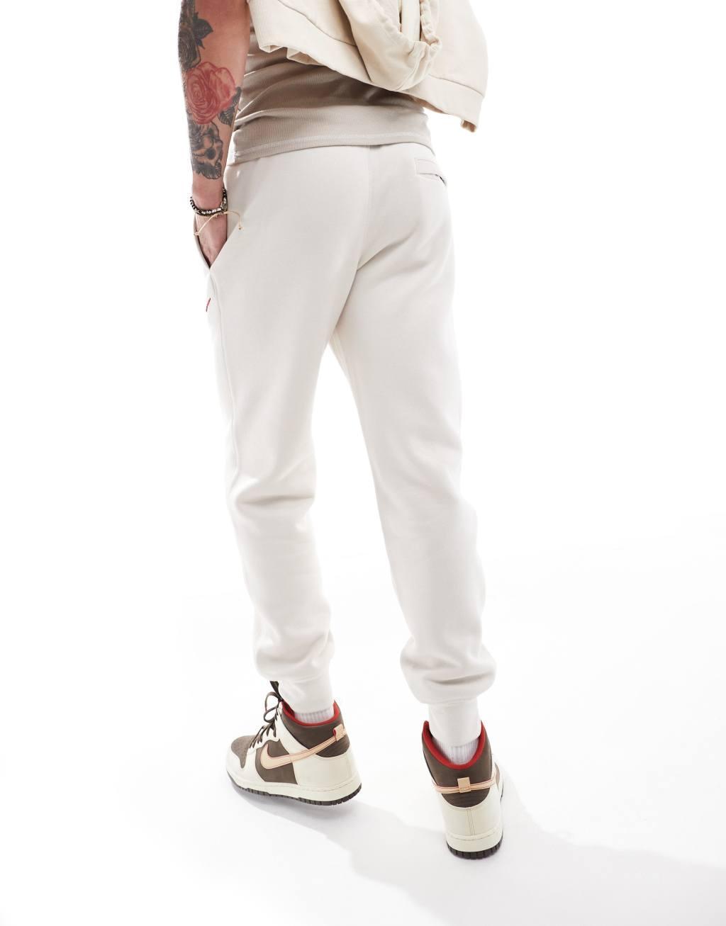 Nike Club Chenile Futura logo joggers in beige Product Image