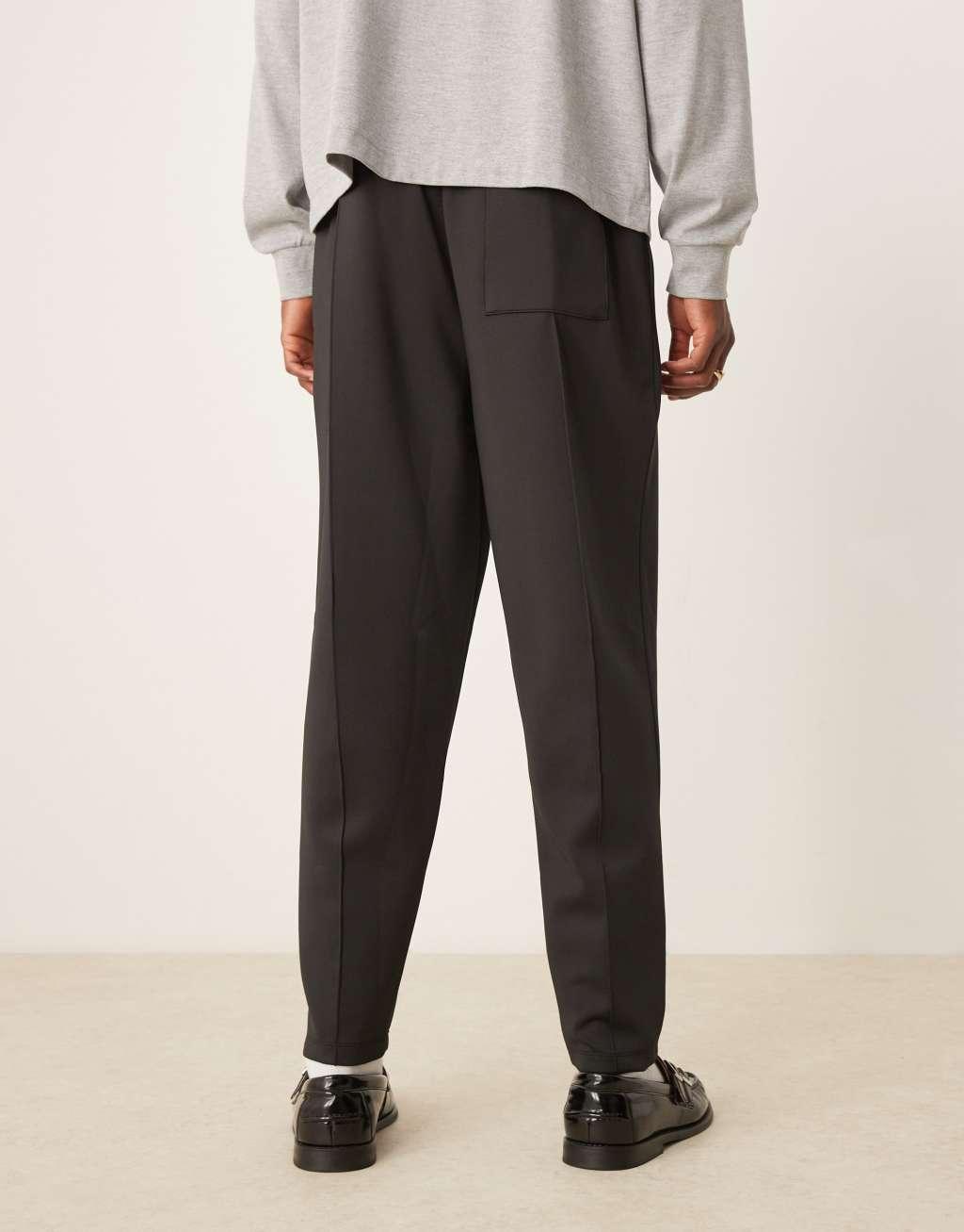 ASOS DESIGN relaxed tapered scuba sweatpants with pintucks in black Product Image