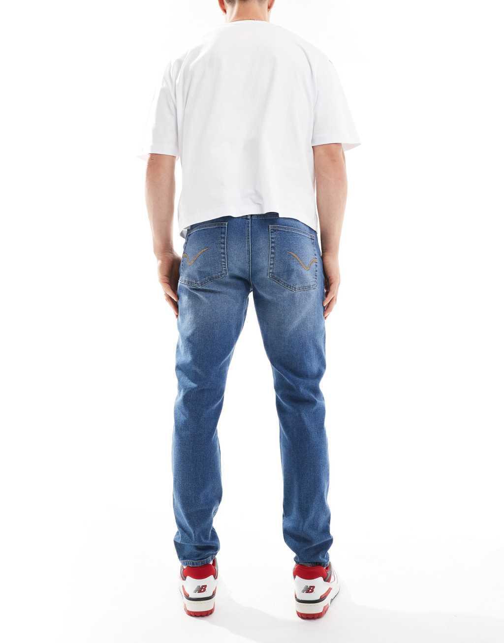 ONLY & SONS slim tapered jeans in mid blue wash Product Image