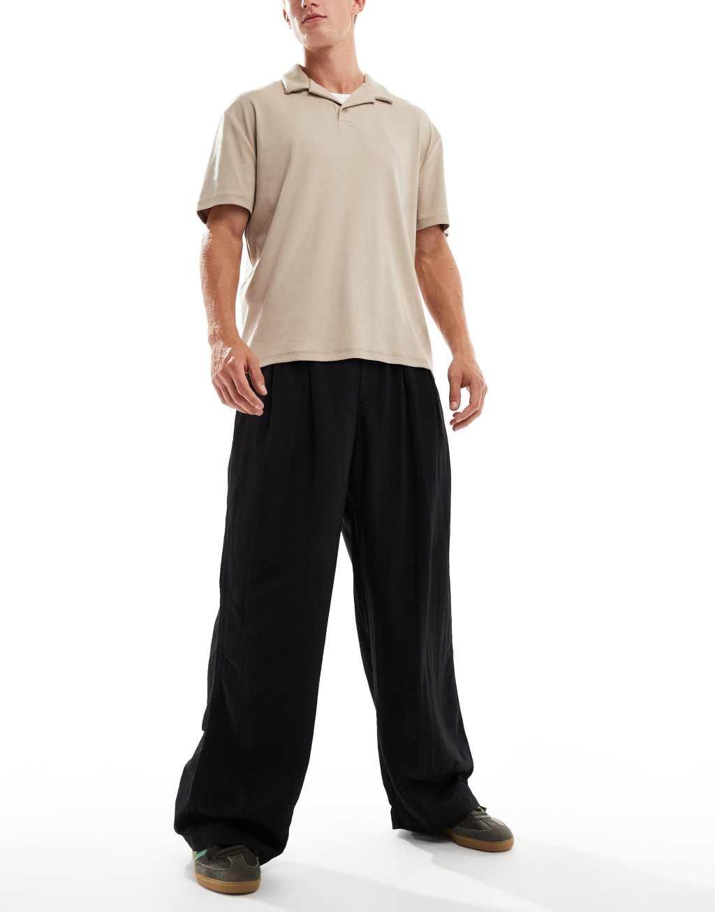 ASOS DESIGN baggy balloon chinos with pleats in black Product Image