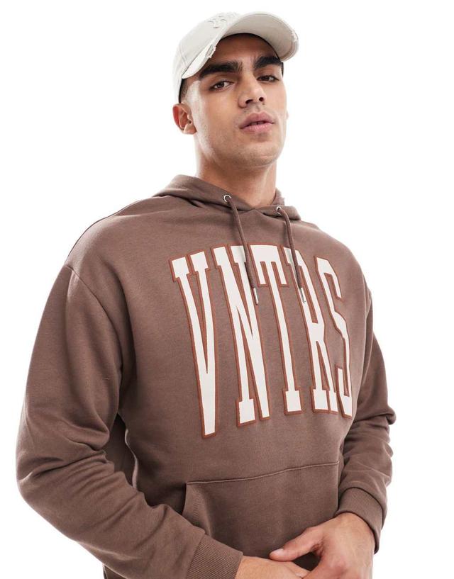 ASOS DESIGN oversized sweatshirt with chest applique in brown Product Image