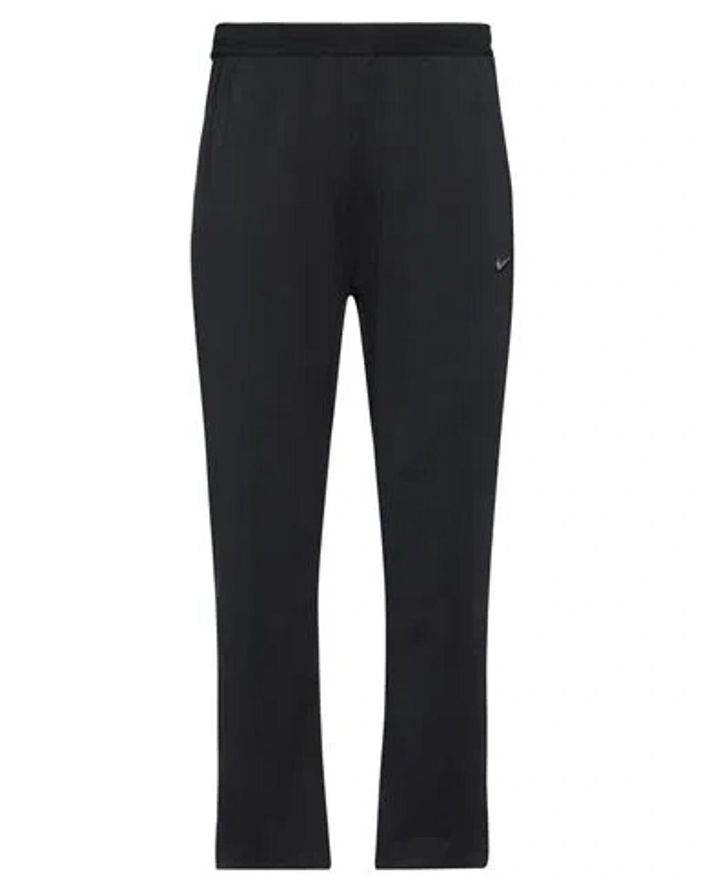 NIKE Man Pants Black Size L Polyester, Elastane Product Image