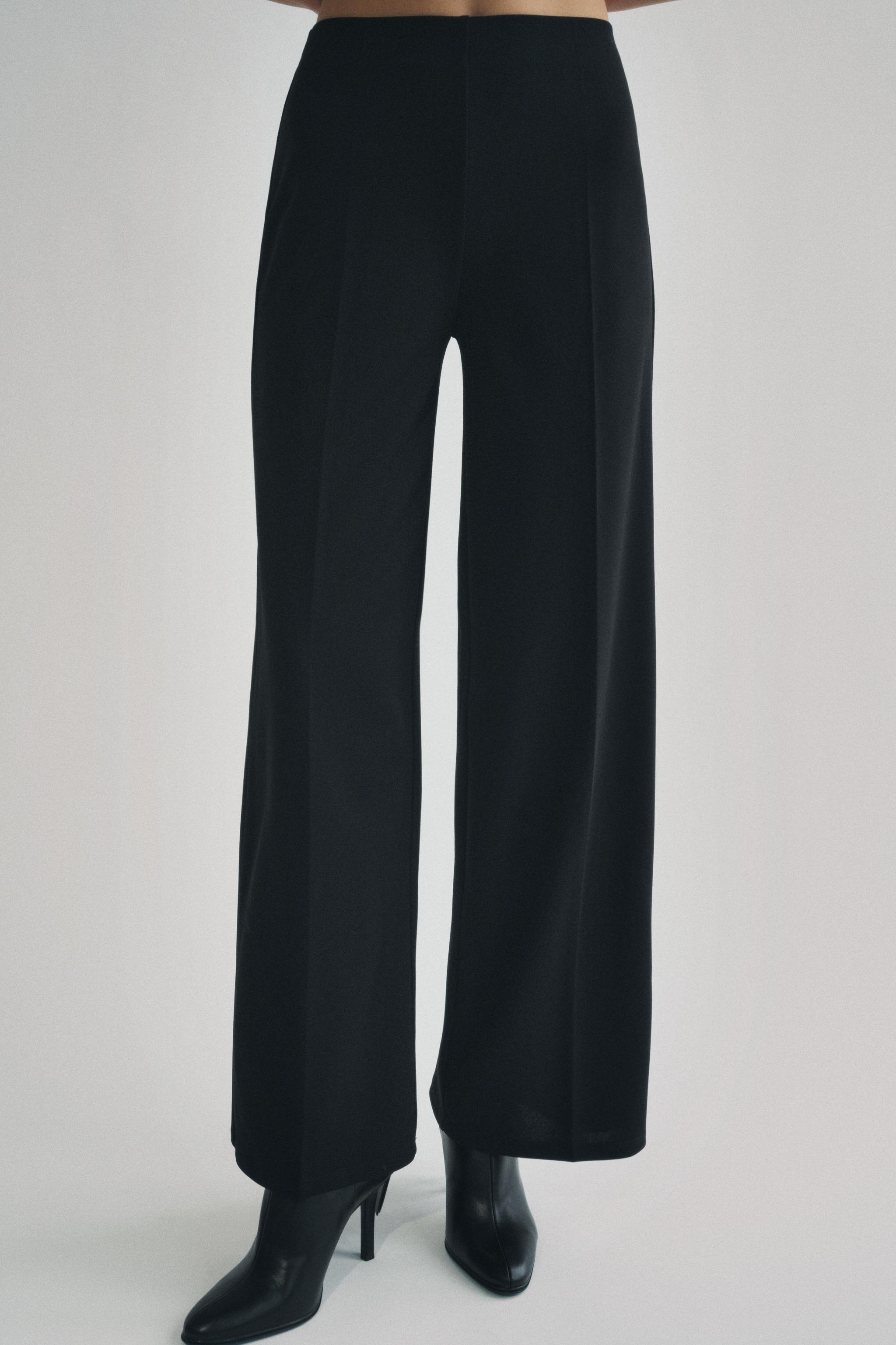 Wide leg pants with a high waist. Hidden zip closure at side. Product Image