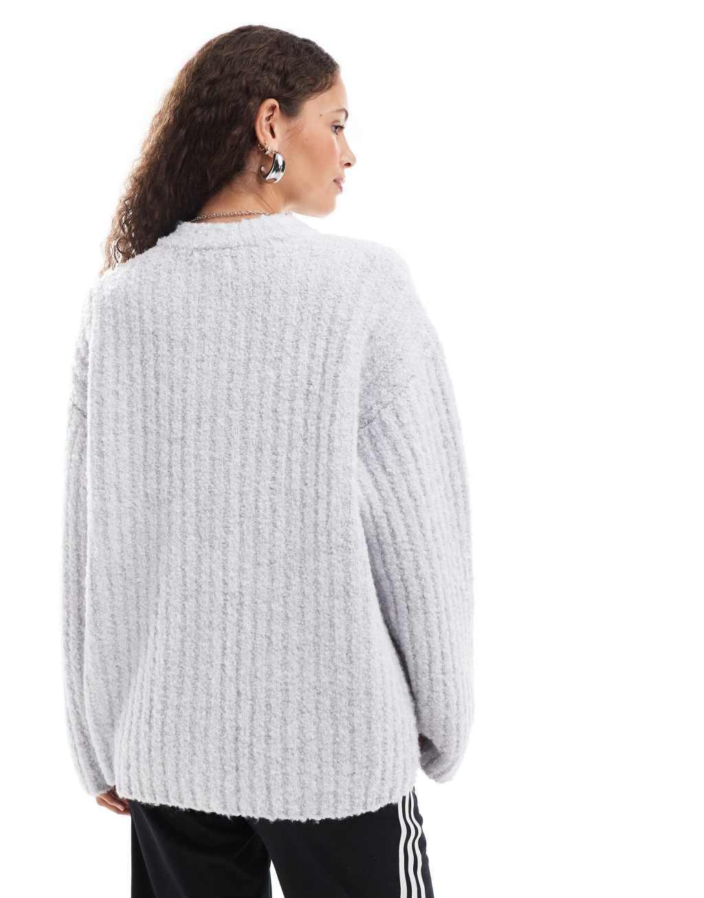 Monki chunky knit rib high neck cardigan with button front and front flap pockets in gray melange Product Image