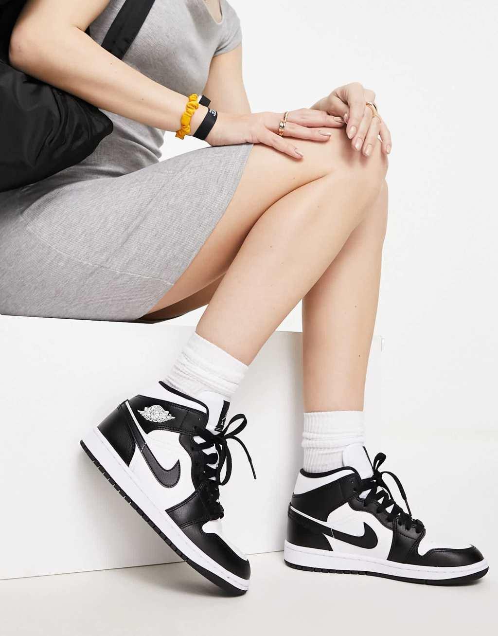 Nike Air Jordan 1 Mid sneakers in white and black product image