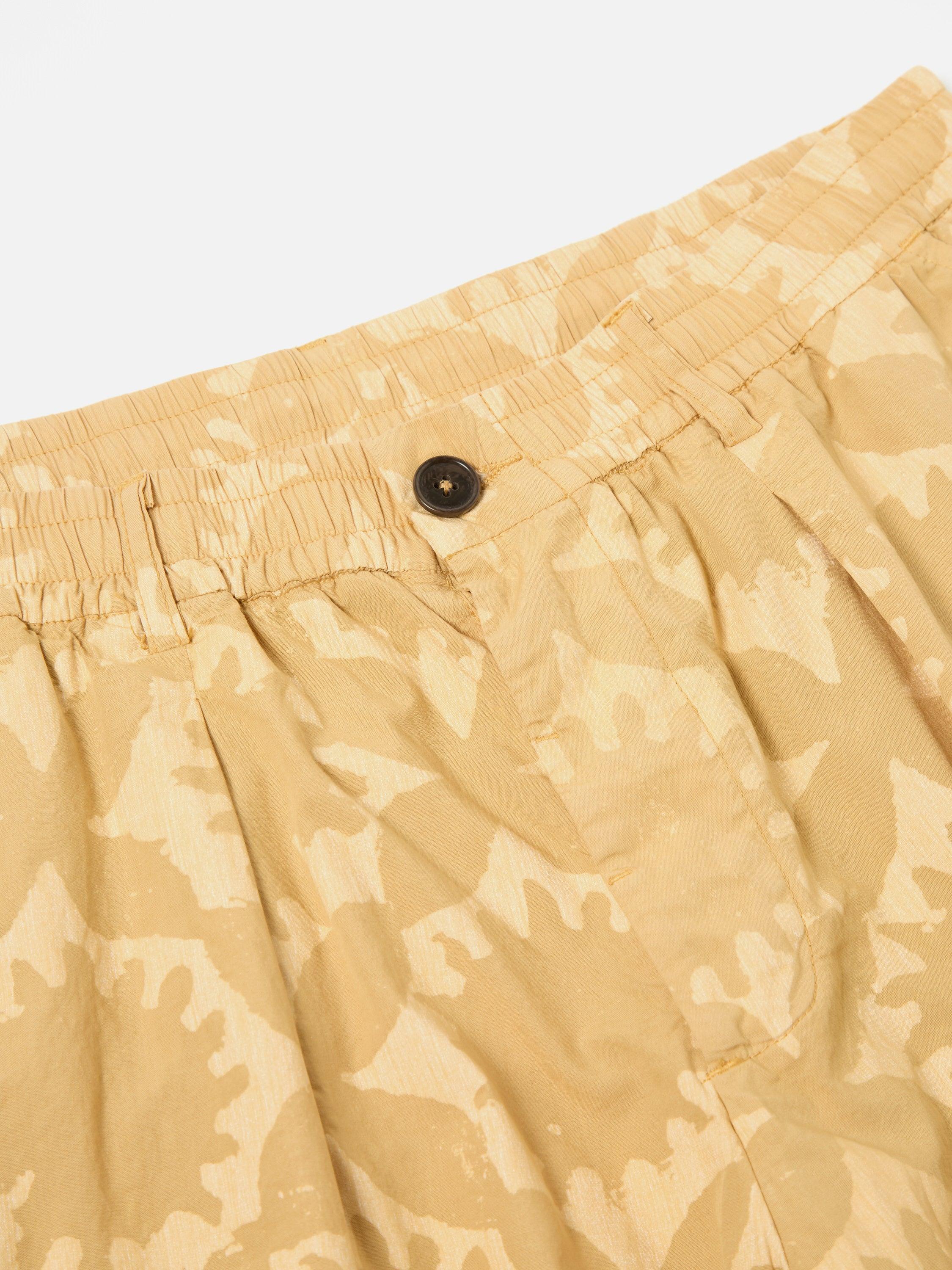 Universal Works Pleated Track Short in Sand Over Dyed Sun Print Product Image