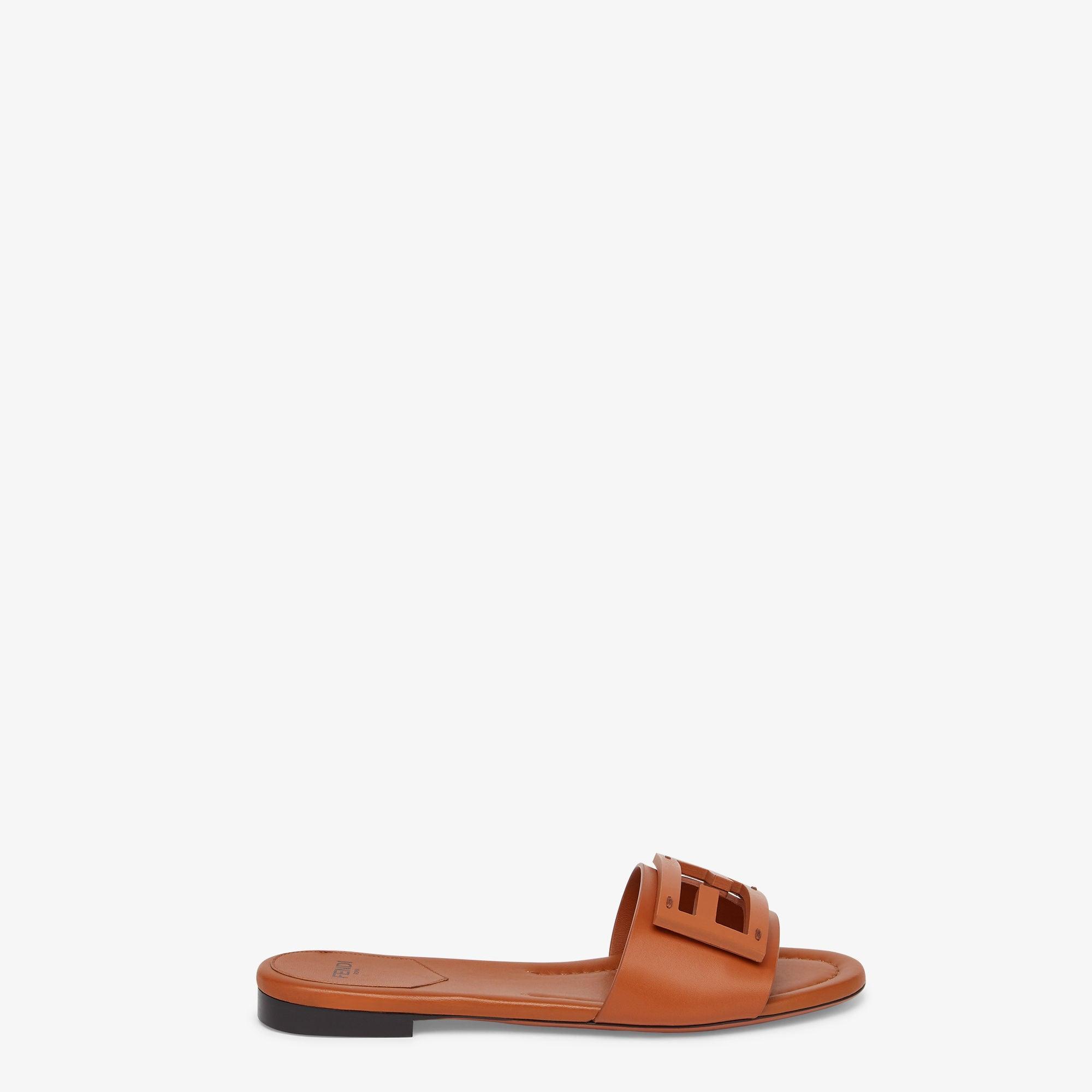 BaguetteBrown leather slides Product Image