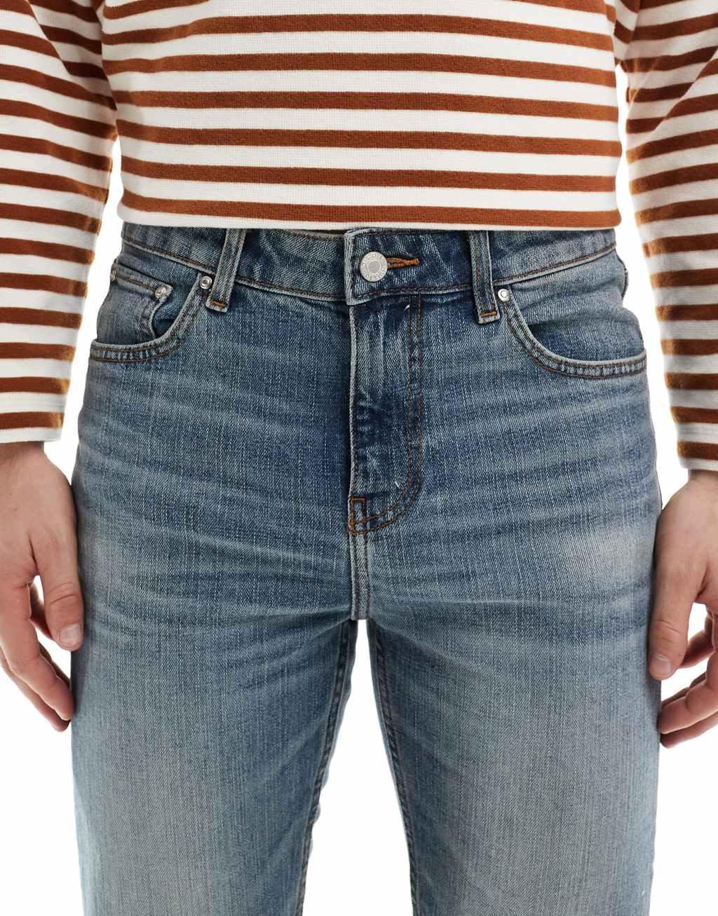 ASOS DESIGN skinny jeans in mid wash blue Product Image