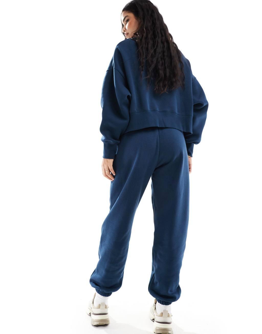 Nike Mini Swoosh sweatpants in navy Product Image